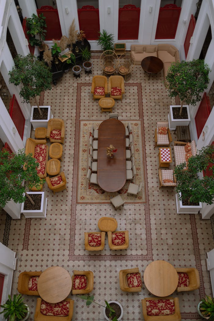 Top-down view of a luxurious hotel atrium in İstanbul with elegant seating and decor.